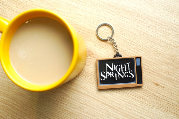 Alan Wake II Night Springs Keychain Charm