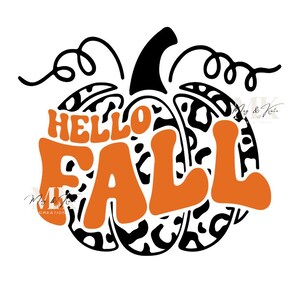 May include: A pumpkin-shaped design with the words "HELLO FALL" in orange, retro-style lettering. The pumpkin has a black stem and vine, and a black and white leopard print pattern. The design is on a white background.