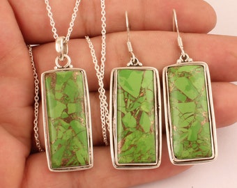 May include: A silver necklace and earrings set with a green turquoise stone pendant and matching earrings. The stones are rectangular and have a marbled pattern.