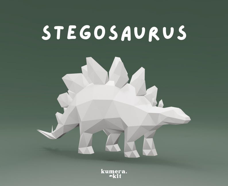 May include: A white origami paper model of a Stegosaurus dinosaur, set against a green background. The dinosaur has a large, spiky back and a long tail.