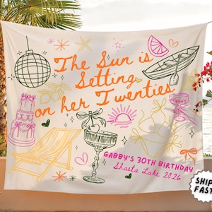 May include: A white tapestry with a hand-drawn design for a 30th birthday celebration. The text "The Sun is Setting on her Twenties" is displayed in orange, with illustrations of a disco ball, cake, and cocktail glass. The text "Gabby's 30th Birthday Shasta Lake 2026" is also included.
