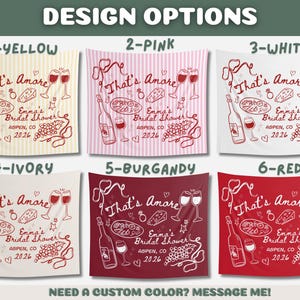 May include: Tapestries with a wine-themed design, featuring the text "That's Amore" and "Emma's Bridal Shower Aspen, CO 2026". Available in yellow, pink, white, ivory, burgundy, and red. Each design includes wine bottles, glasses, and food illustrations.
