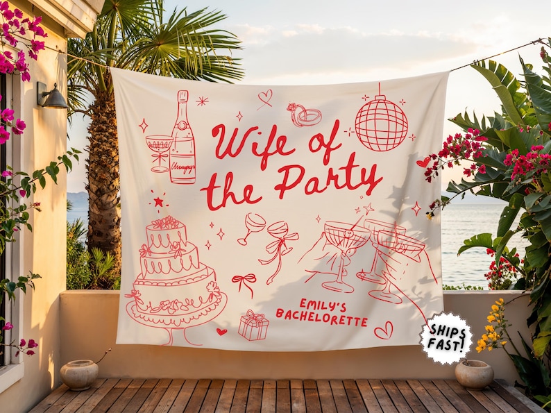 Peut inclure: Une banni&egrave;re cr&egrave;me avec des illustrations et du texte en trait rouge. Le texte dit "Wife of the Party" avec "Emily's Bachelorette" en dessous. Les illustrations comprennent une bouteille de champagne, un g&acirc;teau et des verres &agrave; champagne.