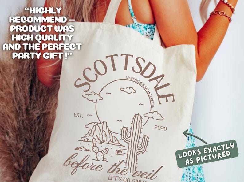 May include: Cream-colored tote bag with a desert-themed design in brown. The design includes the word "Scottsdale", a mountain range, a cactus, and the text "before the veil". The bag also has the text "Looks exactly as pictured".