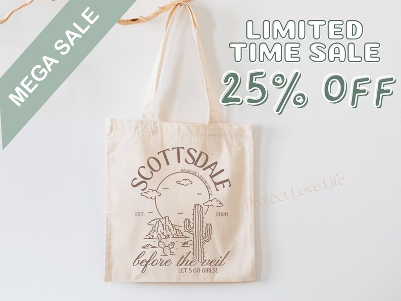 May include: Beige tote bag with a Scottsdale, Arizona design. The design includes a desert landscape with a cactus, mountains, and the text "Scottsdale" and "before the veil". The bag also has the text "MEGA SALE" and "LIMITED TIME SALE 25% OFF".
