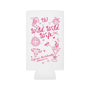 May include: White can cooler with pink text and illustrations. The text reads "Wild Wild Wife" with a cowboy boot, horseshoe, and disco ball graphic. Includes "EST. 2026" and "Tiffany's Bachelorette, Nashville, TN."
