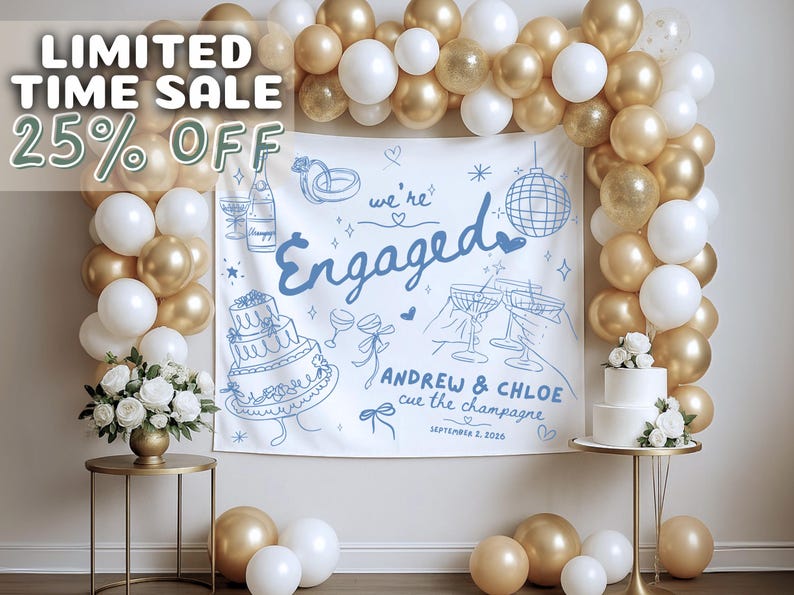 May include: A white fabric backdrop featuring blue line art of a wedding cake, champagne, rings, and a disco ball, with the text "we're Engaged", "ANDREW & CHLOE", "cue the champagne", and "SEPTEMBER 2, 2026". It is framed by a gold and white balloon arch.
