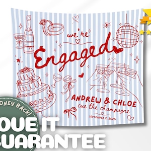 May include: A square fabric banner with a light blue and white vertical striped pattern. Red line art illustrations include a champagne bottle, wedding rings, a disco ball, a tiered cake, and cocktail glasses. Text reads: we're Engaged, ANDREW & CHLOE, cue the champagne, SEPTEMBER 2, 2026.