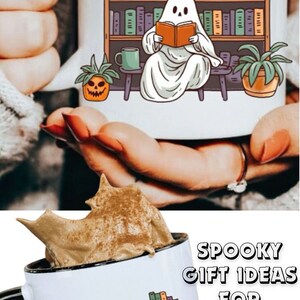 May include: A white ceramic mug with a black handle features a ghost reading a book in a library setting. The ghost is sitting on a chair in front of a bookshelf filled with books. There are two potted plants, one with a jack-o-lantern face, and a small green mug on a table. The text "SPOOKY GIFT IDEAS FOR BOOK LOVERS" is written in black on a white background.