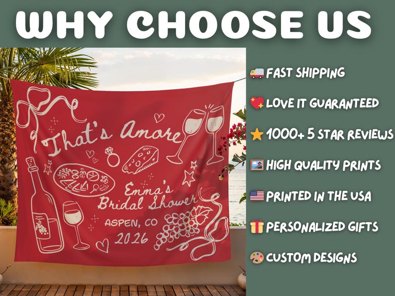 May include: Red tapestry with white illustrations and text. The text reads "That's Amore" and "Emma's Bridal Shower Aspen, CO 2026". The design includes wine glasses, a bottle, pizza, cheese, and a ring.