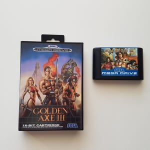 May include: A Sega Mega Drive game cartridge for Golden Axe III. The game cartridge is black with a blue label that says "Sega Mega Drive". The game cartridge is in its original box, which is black with a colourful image of the game's characters.