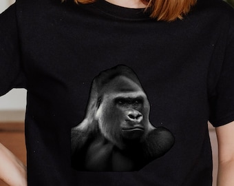 May include: A black t-shirt with a black and white image of a gorilla's face on the front.