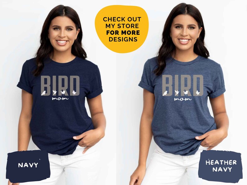 May include: Two women wearing navy blue t-shirts with the text "BIRD MOM" and a graphic of birds. The t-shirt on the left is navy blue, and the t-shirt on the right is heather navy.
