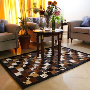 Add rustic elegance with our Cowhide Patchwork Runner. Unique Patchwork Cowhide Rug Decor, Handmade in Custom Size. Perfect Cowhide Area Rug for Living Room & beautiful Home Decor Rugs. Natural, durable statement piece.