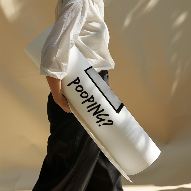 May include: A white yoga mat with black text that says "POOPING?" in a comic book style font. The mat is rolled up and being held by a person.