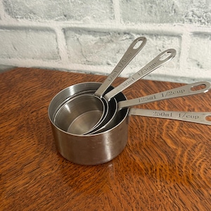 Set of 4 vintage metal measuring cups stacking kitchen utensils