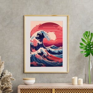 May include: A framed print of a Japanese wave design with a red and pink sunset in the background. The wave is blue and white with splashes of pink.