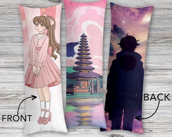 May include: A custom body pillow with a pink and white front featuring a cartoon girl in a pink dress. The back of the pillow features a purple and blue sky with a silhouette of a person standing in front of a temple. The text "CUSTOM BODY PILLOW" is at the top of the image. The text "FRONT" is at the bottom left of the image. The text "BACK" is at the bottom right of the image. The text "ANY PHOTO / IMAGE / TEXT" is at the bottom center of the image.