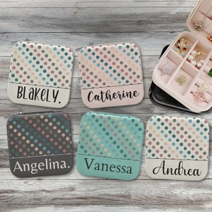 May include: Five small zippered pouches with polka dot patterns in shades of brown, teal, pink, and cream. Each pouch has a different name printed on the bottom: Blakely, Catherine, Angelina, Vanessa, and Andrea.