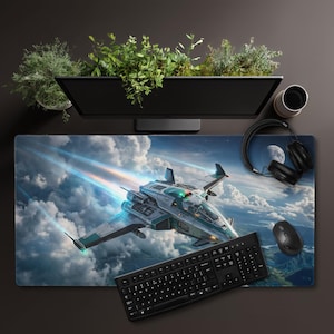 May include: A rectangular desk mat featuring a detailed illustration of a futuristic spacecraft flying through a cloudy sky. The design includes blue light trails, a crescent moon, and a landscape below. A black keyboard, mouse, and headphones sit on top.
