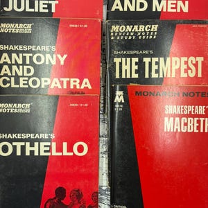 May include: A collection of vintage paperback books featuring classic literature titles. The books have red and black covers with titles like "Romeo and Juliet," "Of Mice and Men," and "The Tempest." The books are from the Monarch Notes Guides series.