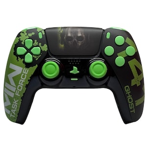 May include: A black and green PlayStation 5 controller with a skull graphic and the text "GHOST" and "TASK FORCE" on the sides.