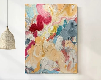 May include: Abstract painting with a colorful, swirling design. The painting features shades of pink, red, yellow, blue, and white. The brushstrokes are visible and create a textured effect.