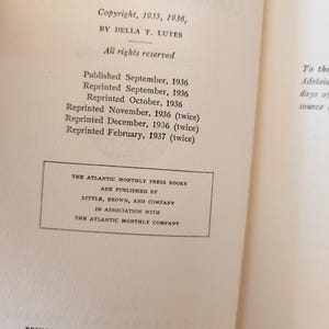 May include: Open book page with text. Copyright information for Della T. Lutes, 1935 and 1936, is visible. Publication and reprint dates from 1936 and 1937 are listed. The Atlantic Monthly Press Books are published by Little, Brown, and Company.