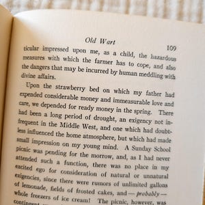 May include: Open book page with text titled "Old Wart" and page number 109. The text is in black font on aged, off-white paper. The book is open, with the text filling the page.