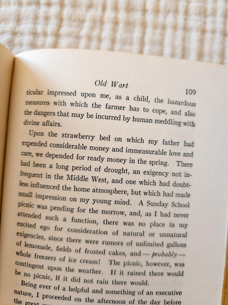 May include: Open book page with text titled "Old Wart" and page number 109. The text is in black font on aged, off-white paper. The book is open, with the text filling the page.