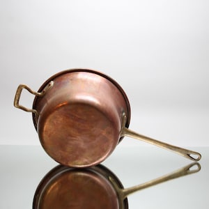 Antique copper pot with long brass handle, beautiful vintage casserole, early 20th century, old copper crockery country house style
