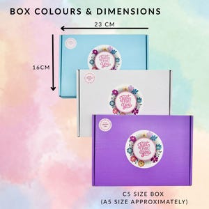 May include: Three colorful C5 size boxes, approximately A5 size, in light blue, white, and purple. Each box features a floral sticker with the text "Just For You." Dimensions are 23 cm wide and 16 cm high.