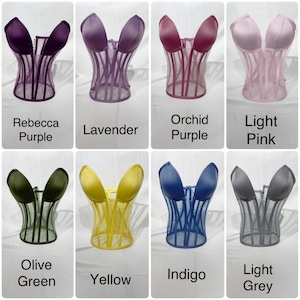 May include: Eight different colored mesh corsets. The colors are: Rebecca Purple, Lavender, Orchid Purple, Light Pink, Olive Green, Yellow, Indigo, and Light Grey.