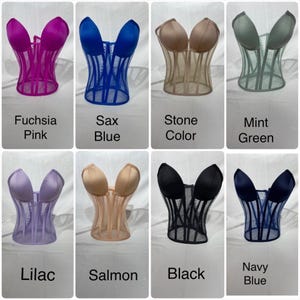 May include: Eight different colored mesh corset tops. The colors are fuchsia pink, sax blue, stone color, mint green, lilac, salmon, black, and navy blue.