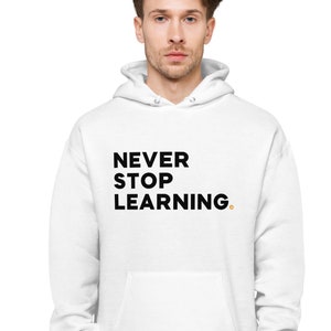 May include: White hooded sweatshirt with the text "NEVER STOP LEARNING." printed in black.