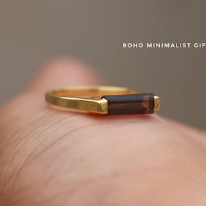 May include: A gold ring with a brown rectangular gemstone.  BOHO MINIMALIST GIFT.