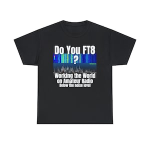 May include: Black t-shirt with white text that reads "Do You FT8? Working the World on Amateur Radio Below the noise level". The text is above a blue and green graphic of a radio signal.