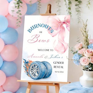 May include: A sign on an easel with the text "Burnouts or Bows" in blue and pink, announcing a gender reveal for Amanda & Joshua. The sign features a watercolor bow and tires with flames, surrounded by pink and blue balloons.