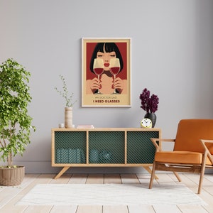 May include: A poster with a woman holding two glasses of red wine. The text on the poster reads "My doctor said I need glasses."
