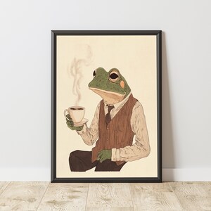 May include: A green frog wearing a brown vest and a tie, holding a cup of coffee. The frog is sitting on a light brown background.