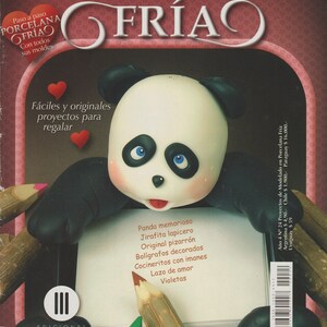 May include: A book cover with a panda bear holding a pencil and a book. The cover is pink and white with the title "Proyectos de modelado en Porcelana Fría" and the text "Fáciles y originales proyectos para regalar".
