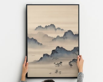 May include: A framed print of a minimalist landscape painting featuring a misty mountain range in shades of blue and beige.