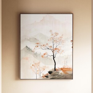 May include: A rectangular wall art print featuring a landscape painting with soft beige and white mountain silhouettes in the background. A single tree with orange-toned leaves stands on a dark rocky foreground, with smaller trees nearby.
