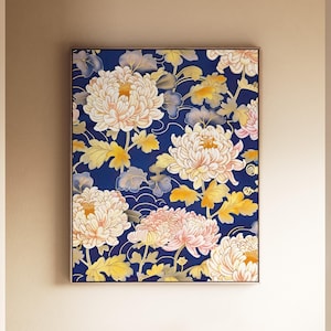May include: A rectangular framed wall art piece featuring a deep navy blue background with a repeating pattern of large, pale cream and soft pink chrysanthemum flowers, accompanied by golden yellow leaves and delicate white line-drawn wave motifs.