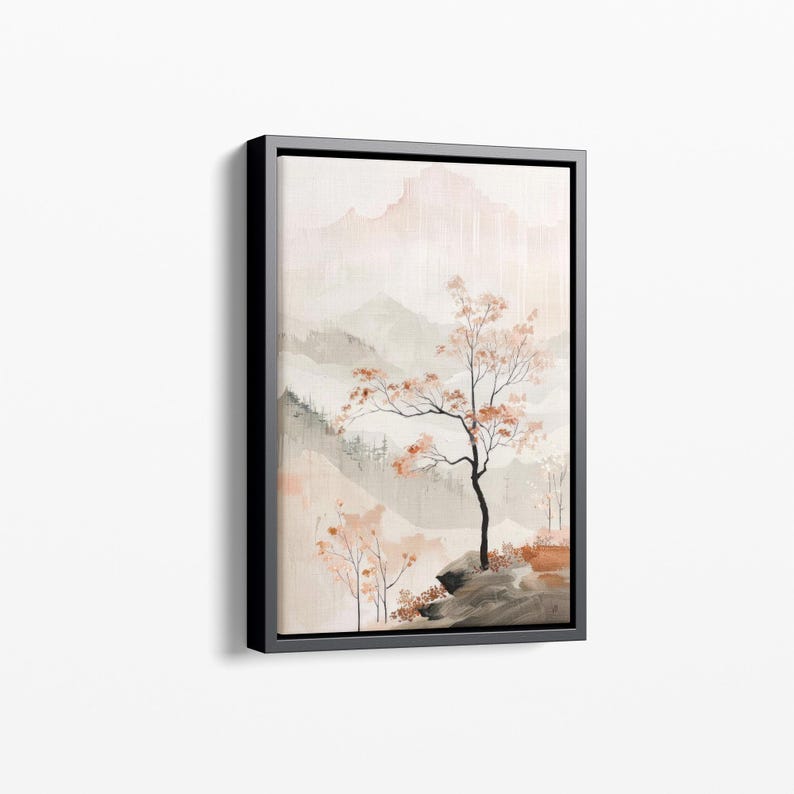 May include: A framed watercolour painting depicting a misty mountain landscape with a solitary tree in the foreground. The tree has delicate branches and pink-tinged leaves. The mountains are painted in shades of grey and pink, with a soft, ethereal quality.