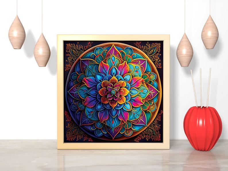 K&ouml;nnte beinhalten: Ein gerahmtes, farbenfrohes Mandala mit filigranen Details in Blaut&ouml;nen, Lila, Rosa, Gelb und Gr&uuml;n. Das Mandala ist von einem schwarzen Hintergrund und einem goldenen Rahmen umgeben.