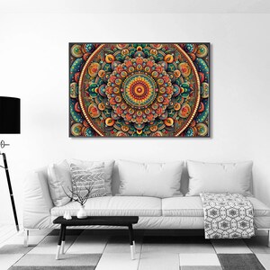 May include: A colorful mandala with intricate details in shades of blue, green, orange, and red. The mandala is surrounded by a border of white beads.