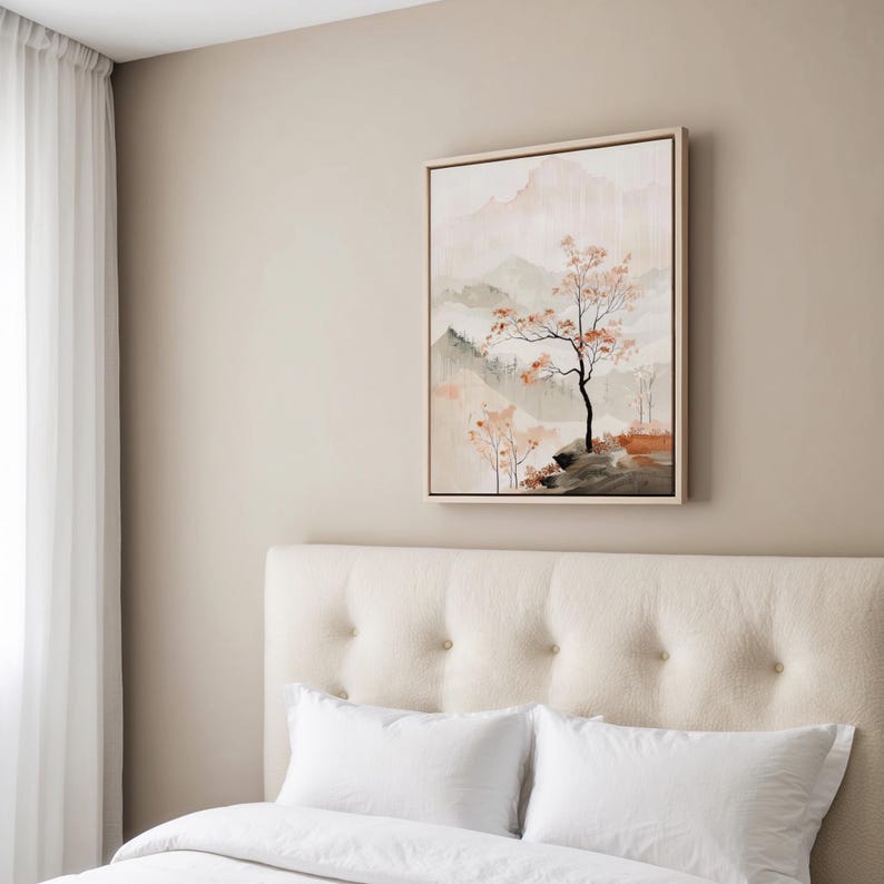 May include: A beige upholstered headboard with a tufted design, a white duvet cover, and two white pillows. A framed painting of a stylised landscape with a tree in the foreground hangs on the wall behind the bed.