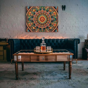 May include: A living room interior with a dark blue velvet sofa, a coffee table with a glass top, and a decorative mandala wall art. The coffee table has a glass top and a wooden frame. The mandala wall art is colorful and intricate.