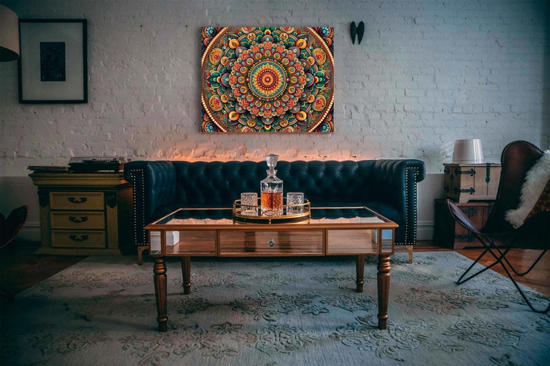 May include: A living room interior with a dark blue velvet sofa, a coffee table with a glass top, and a decorative mandala wall art. The coffee table has a glass top and a wooden frame. The mandala wall art is colorful and intricate.